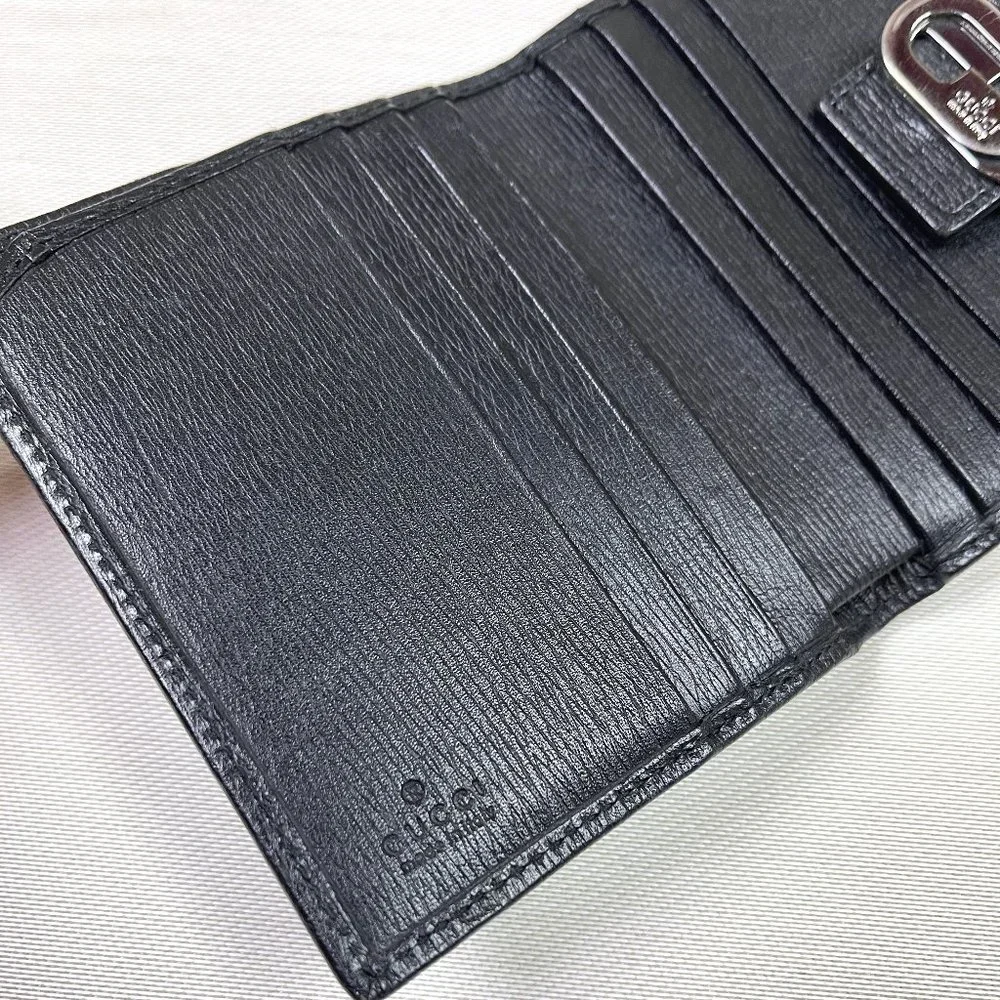 Auc Gucci Snappy Bi-fold GG vintage leather wallet